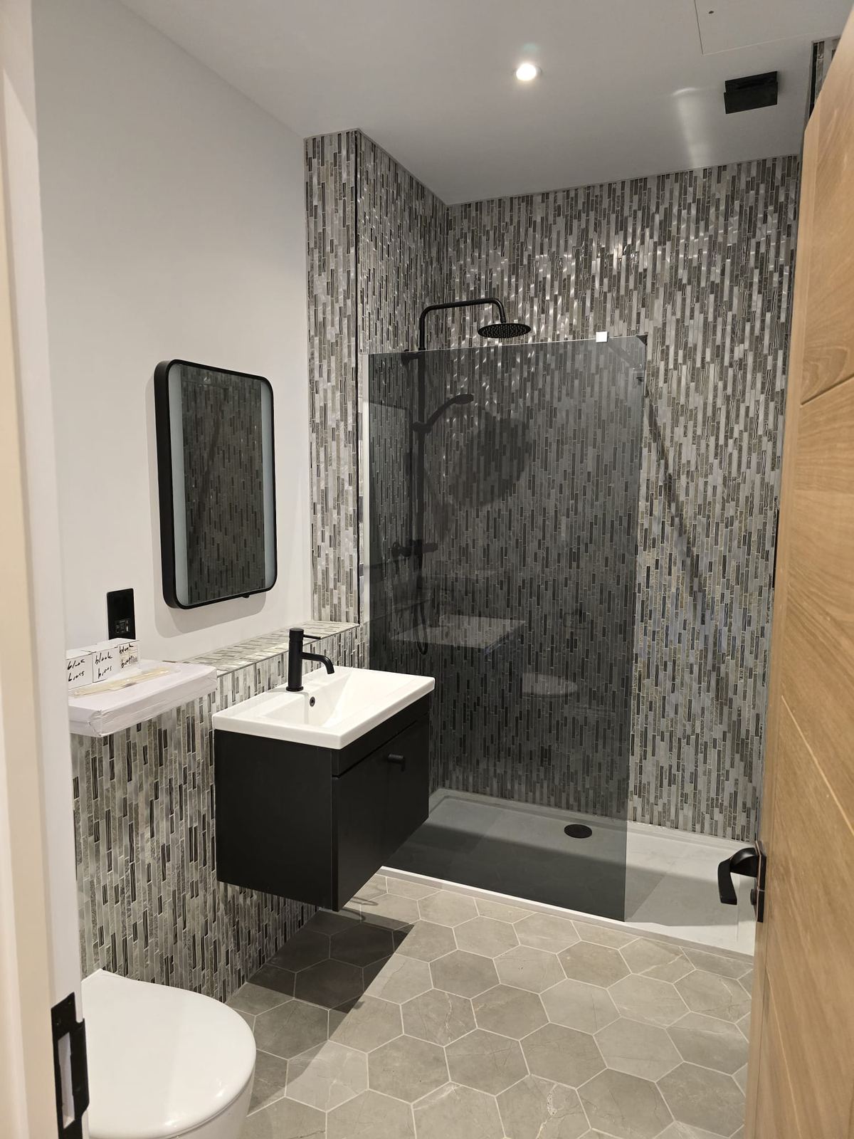 Shower room with mosaic feature wall