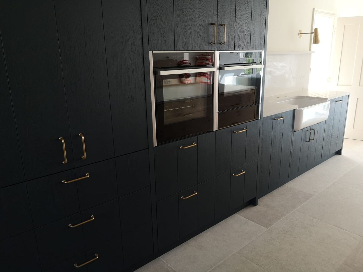 A navy kitchen fitted by M Renovations
